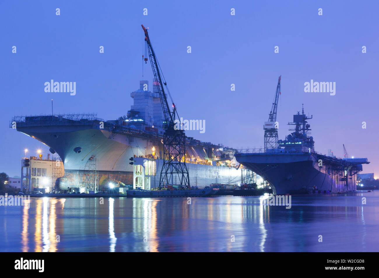 USA, Virginia, Portsmouth, Portsmouth Naval Shipyard, aircraft carriers under construction, dawn
