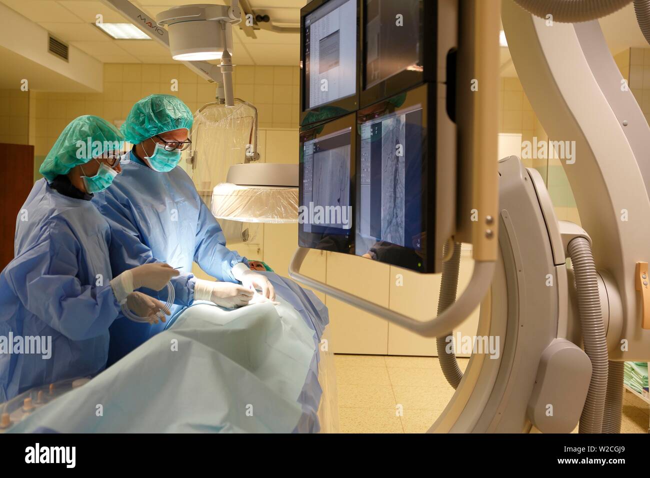 Interventional radiology, doctor with nurse during surgery, Karlovy Vary, Czech Republic Stock Photo