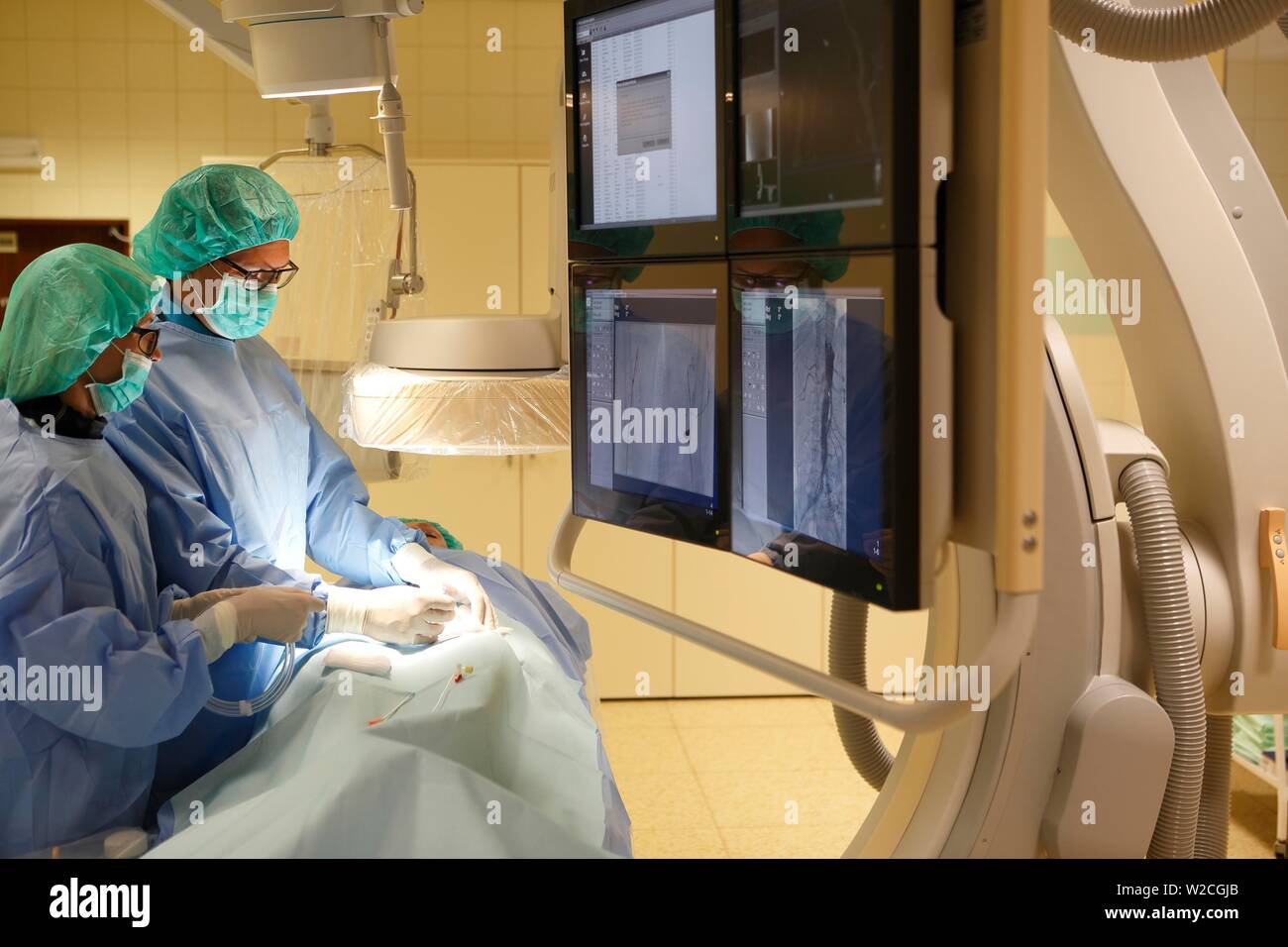 Interventional radiology, doctor with nurse during surgery, Karlovy Vary, Czech Republic Stock Photo