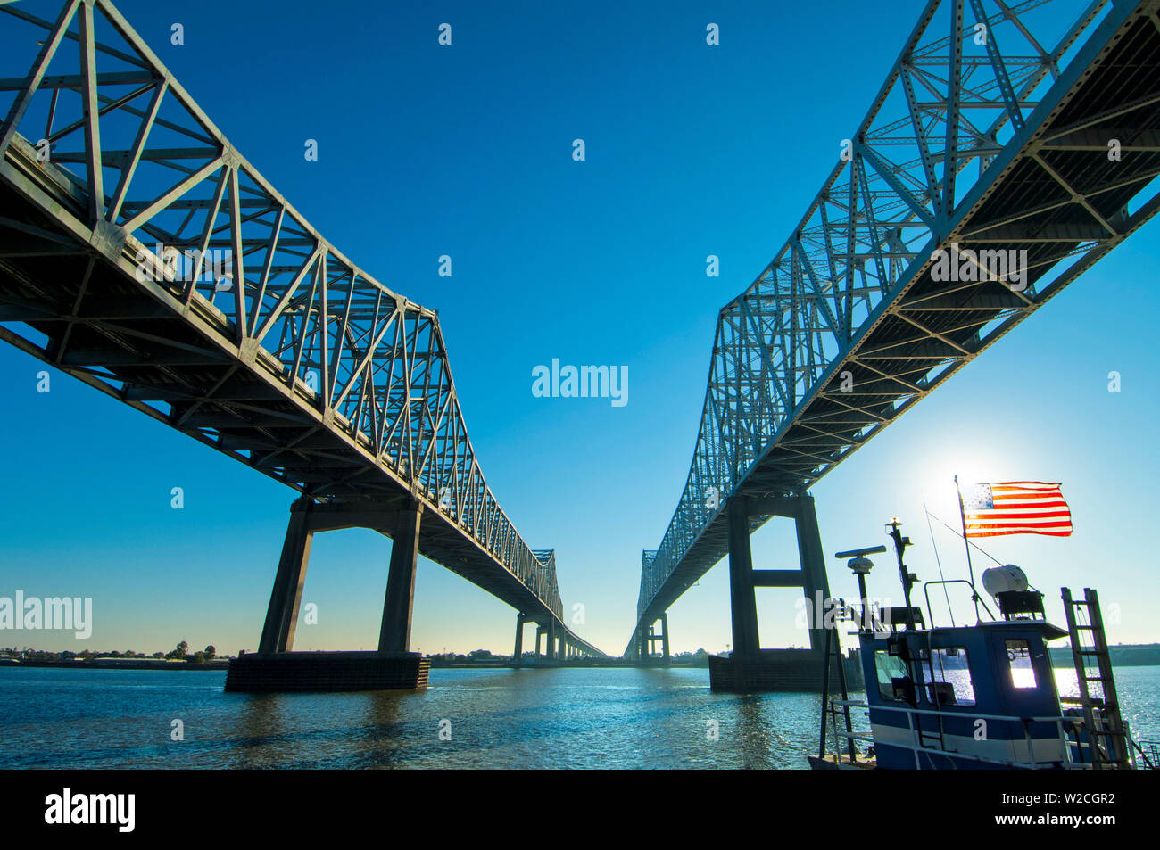 Louisiana, New Orleans, Twin Cantilever Bridges, The Crescent City Connection, Twin Cantilever Bridges, Mississippi River, Tugboat Stock Photo