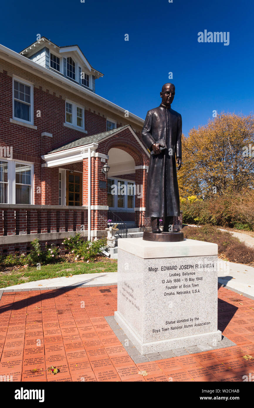 USA, Nebraska, Boys Town, Boys Town Village, childrens refuge, founded in 1917, former home and statue of Father Flanagan, founder Stock Photo