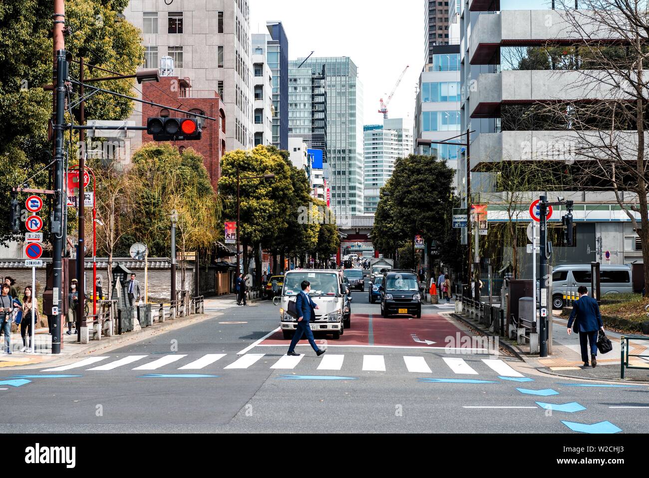 Street scene, pedestrians on zebra crossings, skyscrapers in downtown, city center, Tokyo, Japan Stock Photo