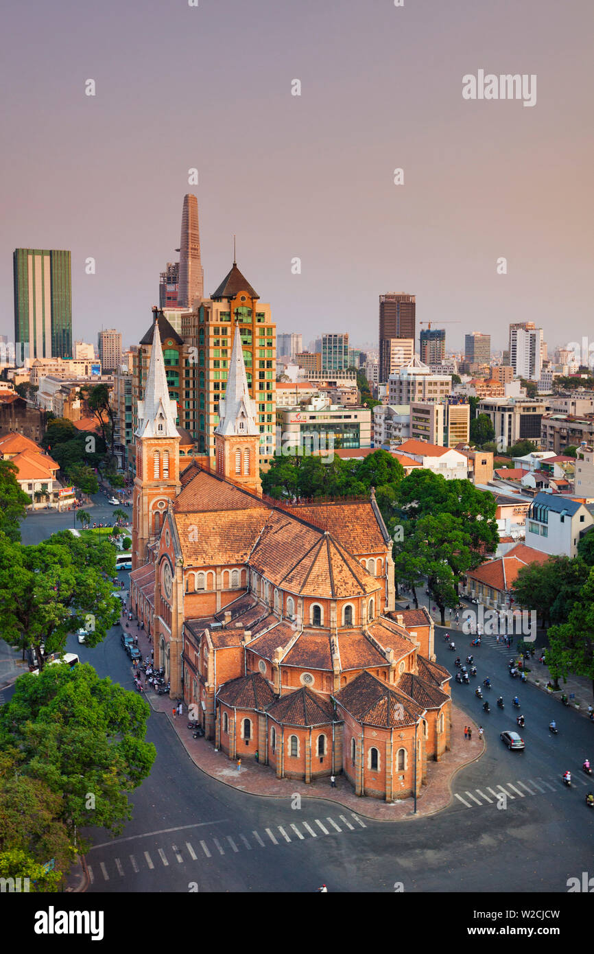 Vietnam, Ho Chi Minh City (Saigon), Notre Dame Cathedral and city skyline Stock Photo