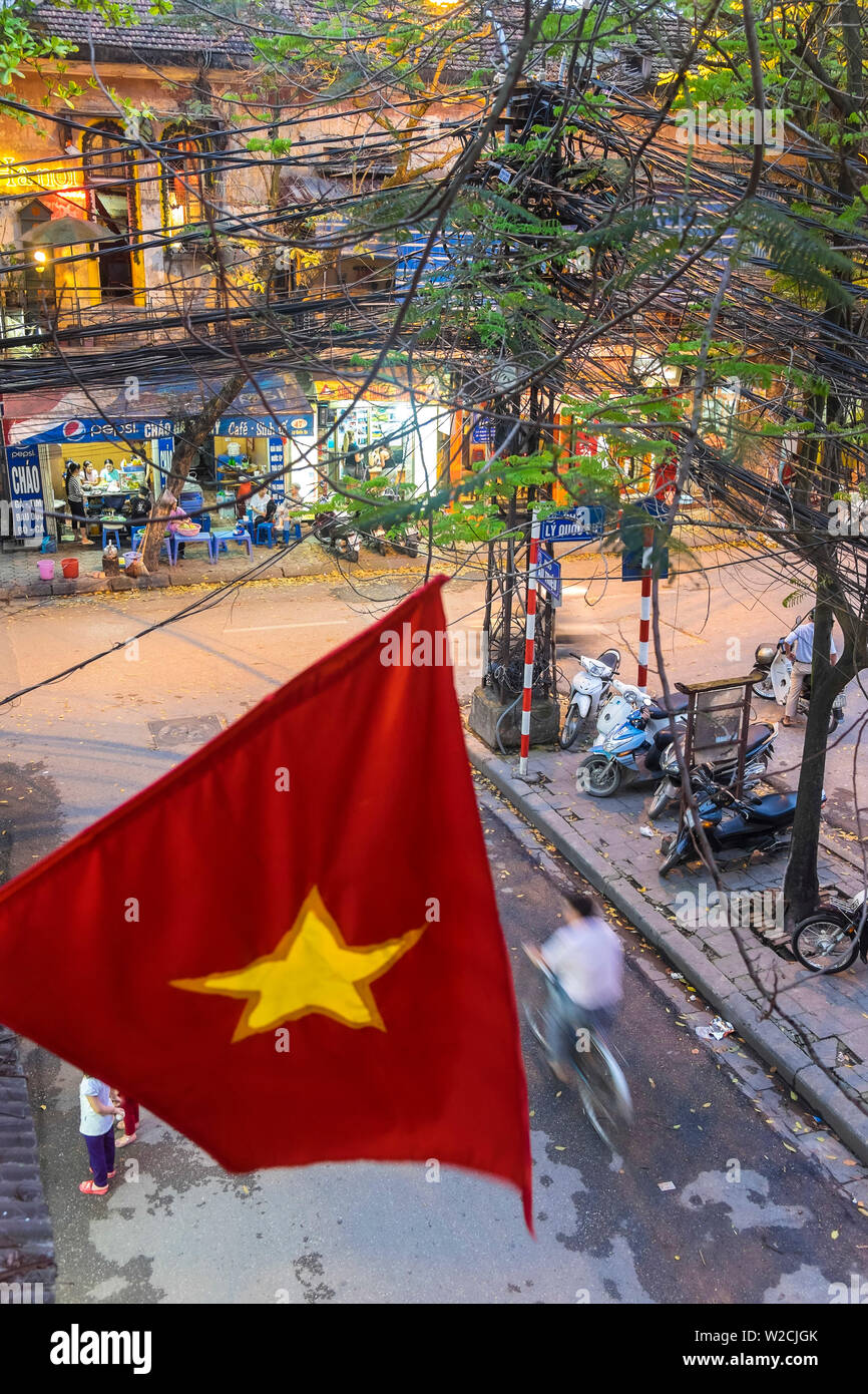 Vietnamese flag & street scene, Hanoi, Vietnam Stock Photo