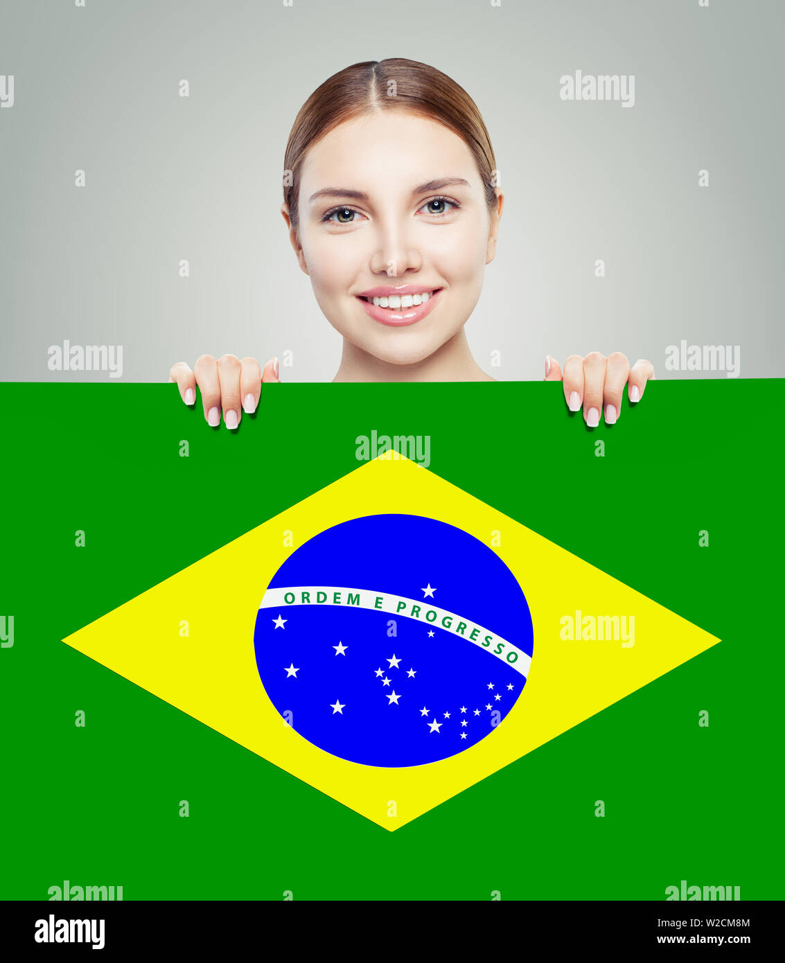 Happy girl with Brazil flag background Stock Photo Alamy