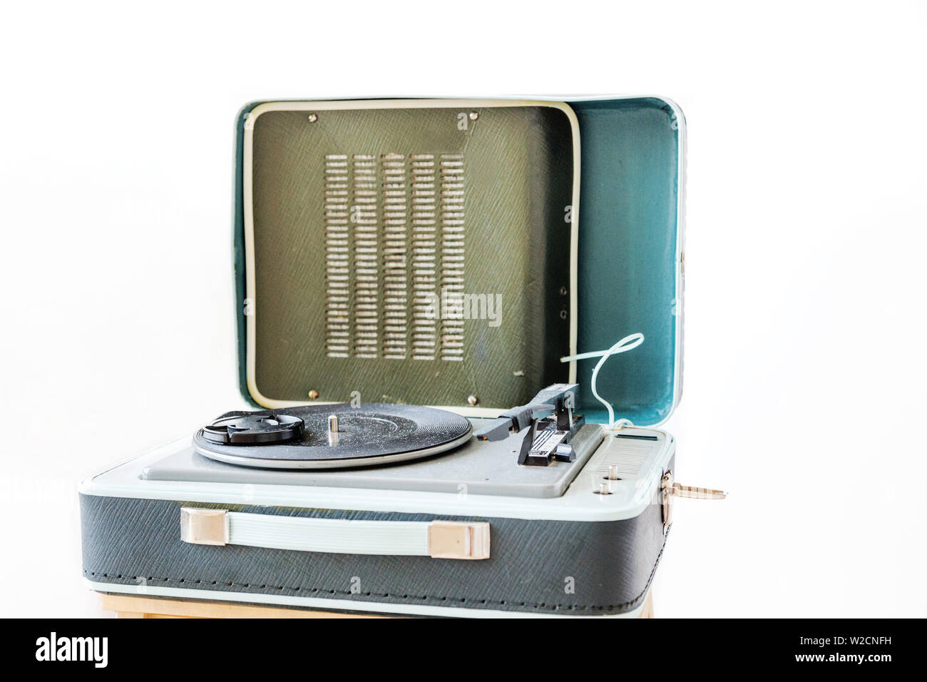 photo of Open vintage suitcase turntable isolated on white background