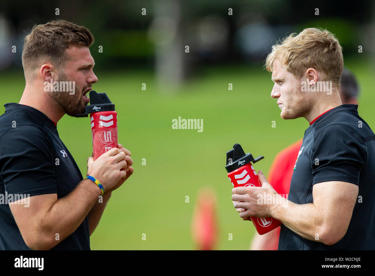 Gareth Davies and Aled Davies take a drink during Wales national rugby team training, July 2019. Stock Photo