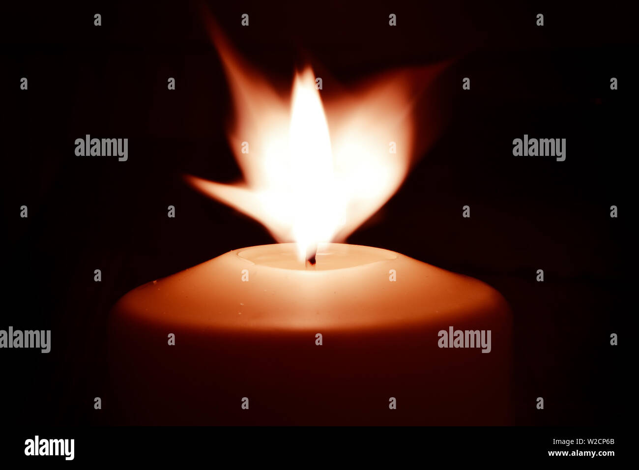 Candle flame in the dark background and space for text Stock Photo - Alamy