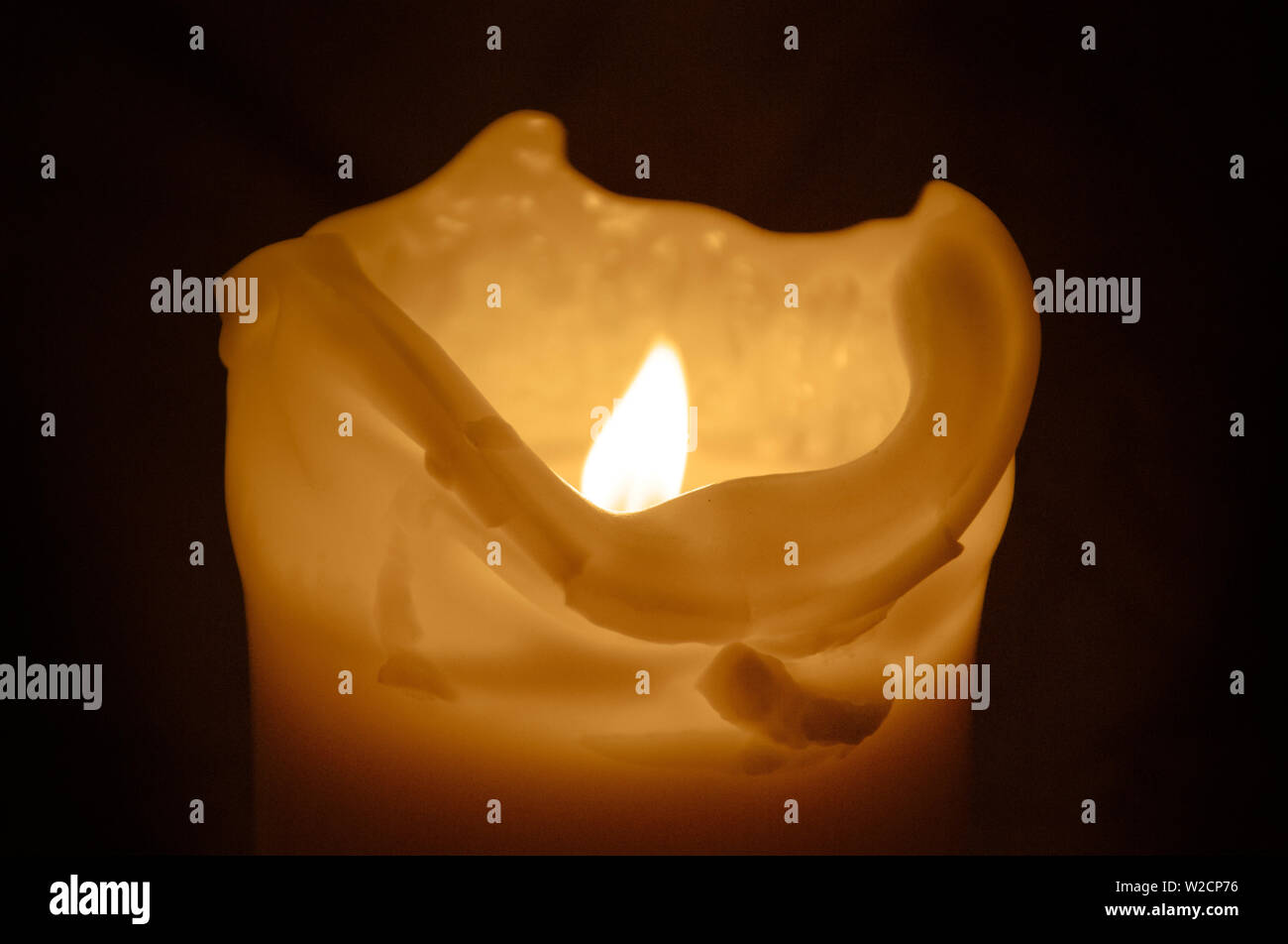 Candle flame in the dark background and space for text Stock Photo - Alamy
