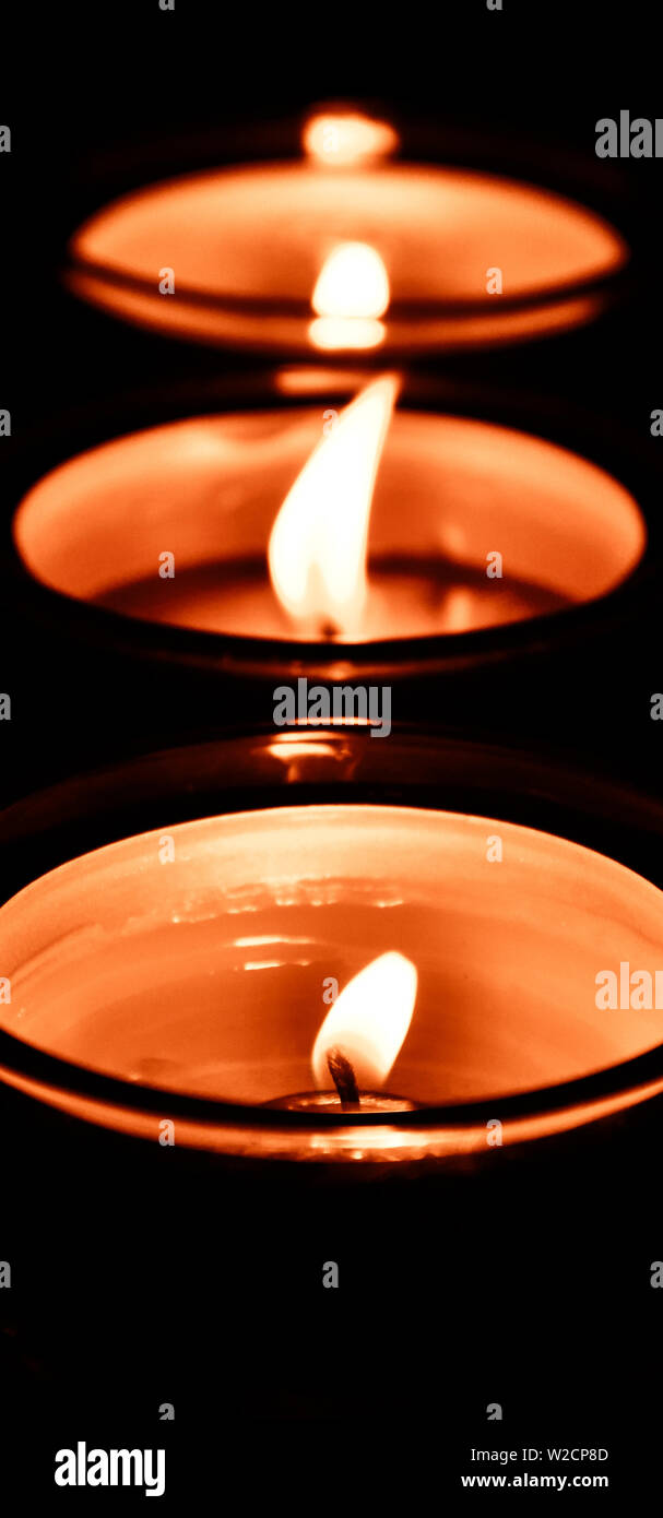 Candle flame in the dark background and space for text Stock Photo - Alamy