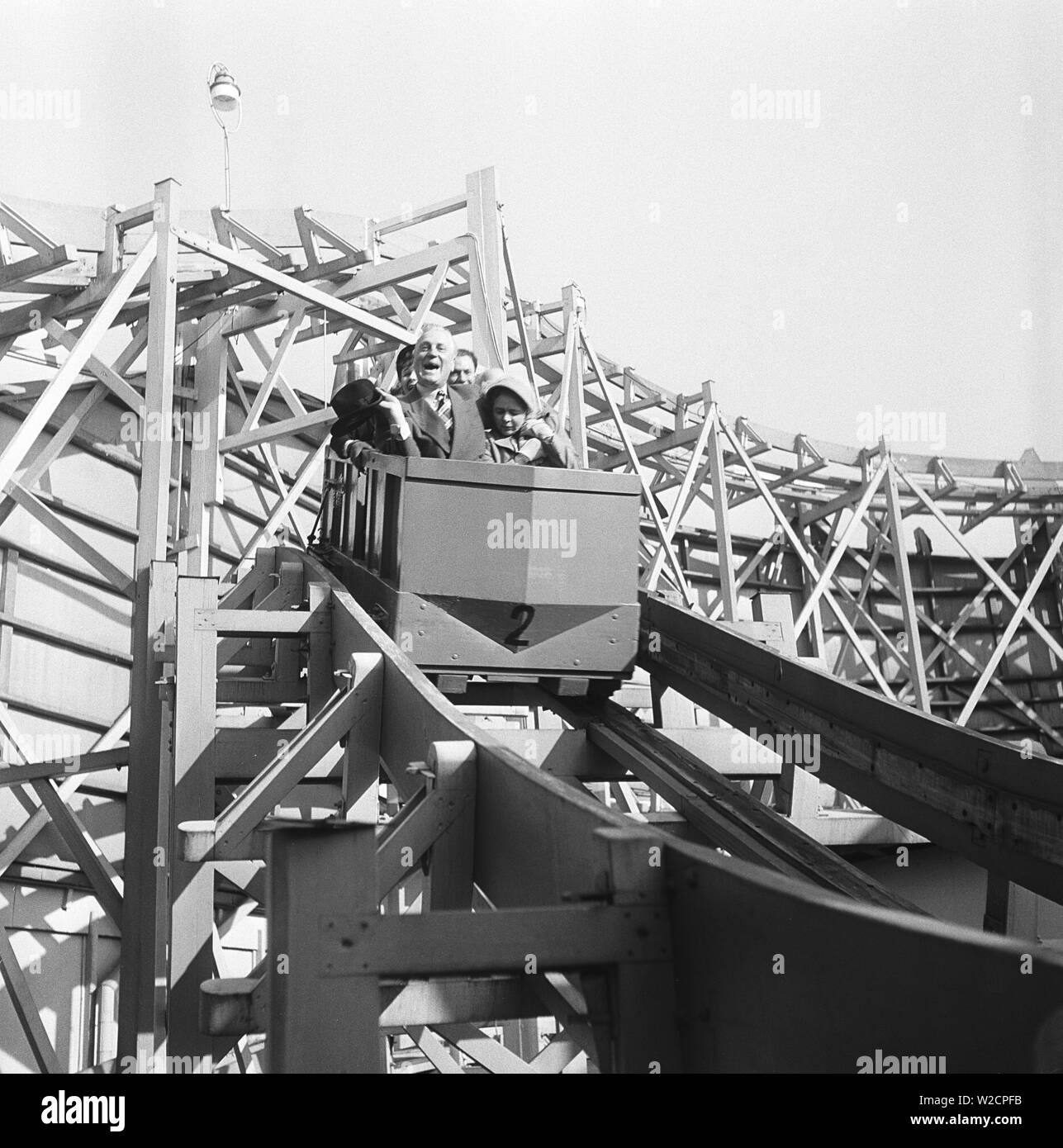 Amusement park in the 1950s. No matter old or young, riding in the rollercoaster makes you happy. Pictured a group of elderly people riding in the rollercoaster. Sweden 1950. Kristoffersson ref AY57-9 Stock Photo