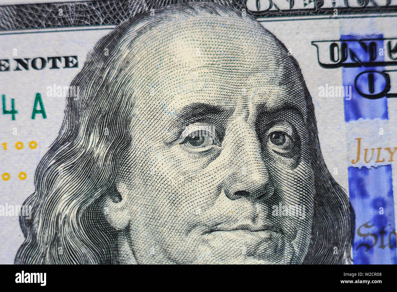 Benjamin Franklin portrait look on 100 dollar paper banknote. One hundred dollars bill closeup. Macro business symbol concept Stock Photo