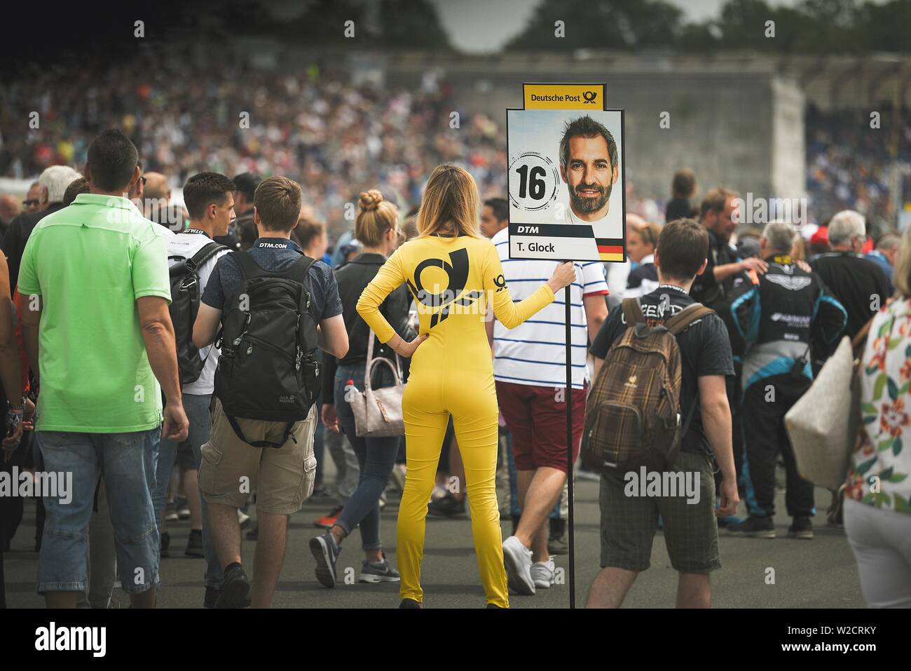 Nuremberg, Germany. 07th July, 2019. Motorsport: German Touring Car Masters, Norisring - 2nd race. A grid girl is standing at the position of Timo Glock (BMW Team RMR). Credit: Nicolas Armer/dpa/Alamy Live News Stock Photo