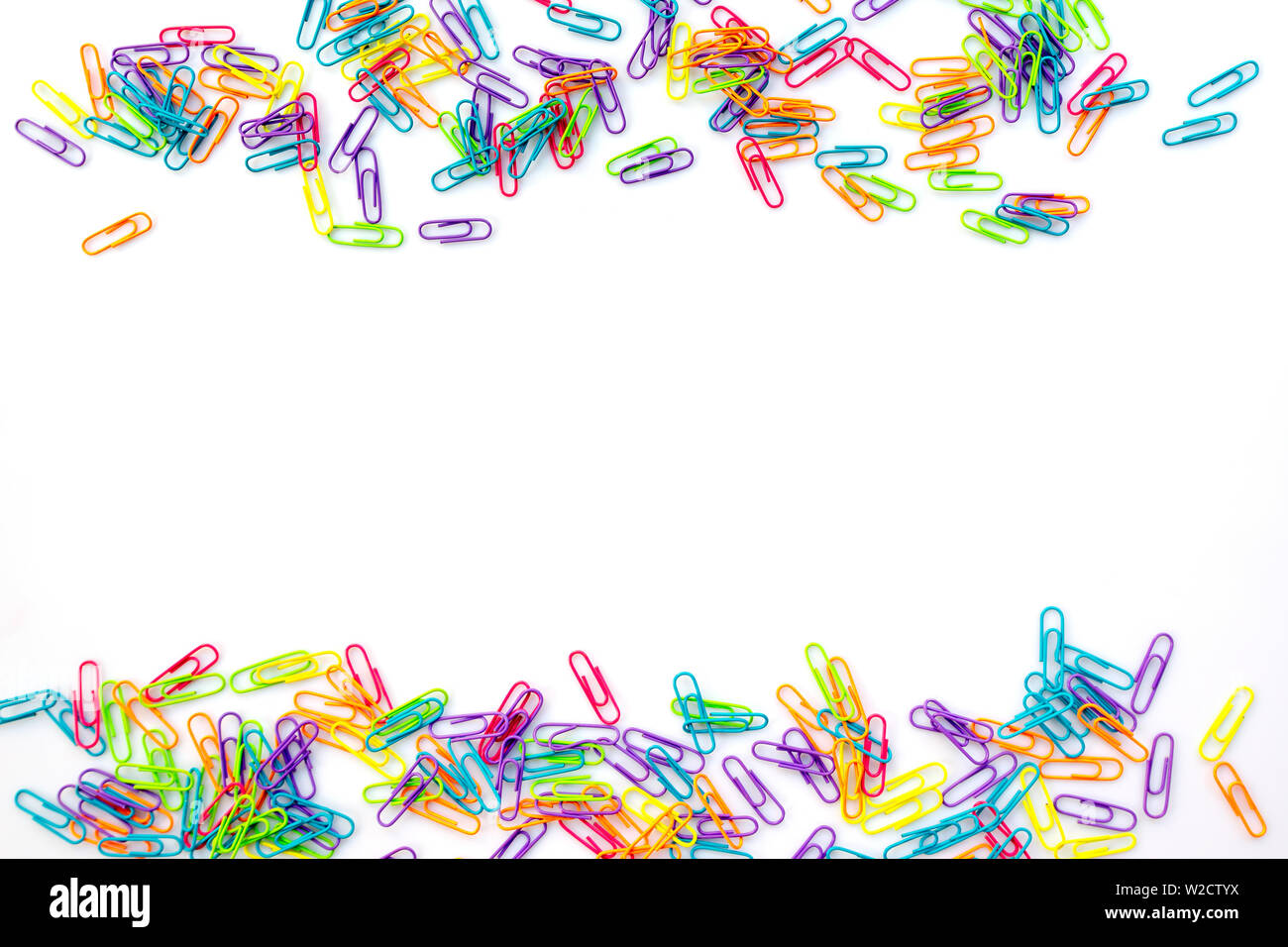 Colorful paper clips isolated on white background with copy space. Back to school concept Stock Photo