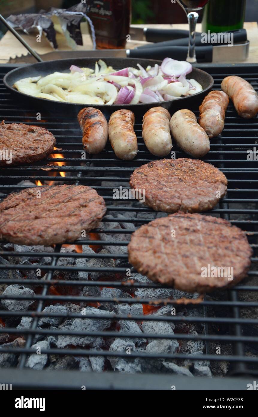 Barbecue beef burgers on flame hi-res stock photography and images - Alamy