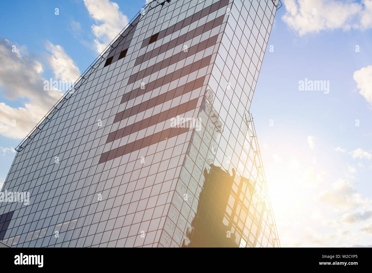 Modern office building on a background of the blue sky and sun Stock ...
