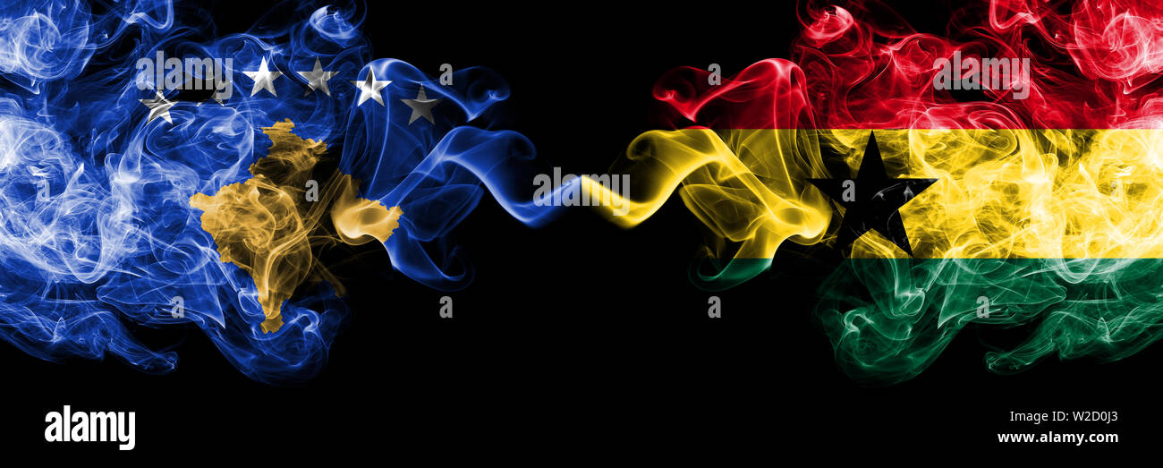 Kosovo vs Ghana, Ghanaian smoky mystic flags placed side by side. Thick colored silky smokes combination of Kosovo and Ghana, Ghanaian flag Stock Photo