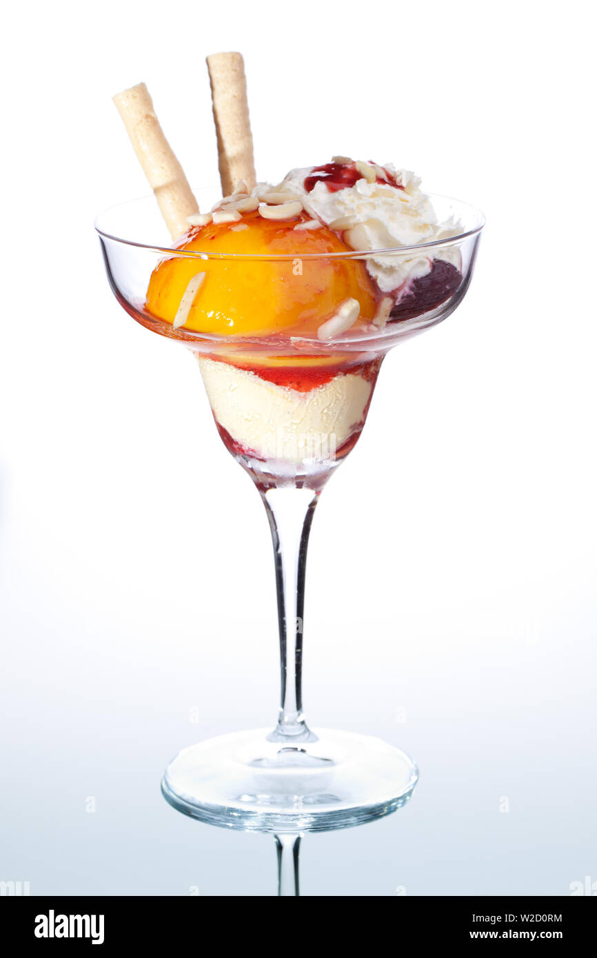 ice cream sundae: A cup of peach ice cream isolated on white background - Pfirsich Melba Stock Photo