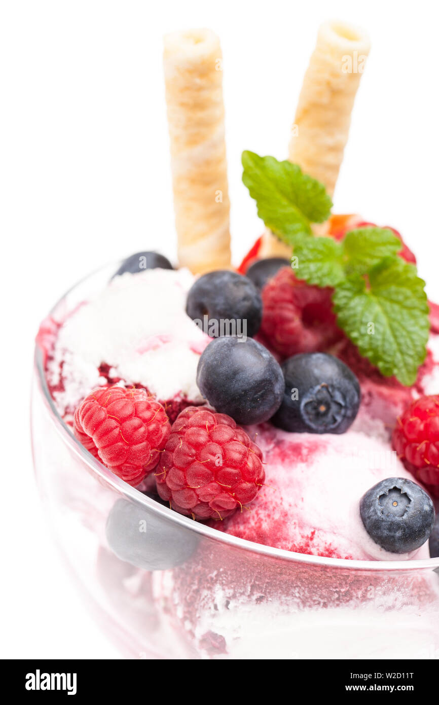 ice cream sundae: detail of wild berry ice cream sundae in front of white background Stock Photo