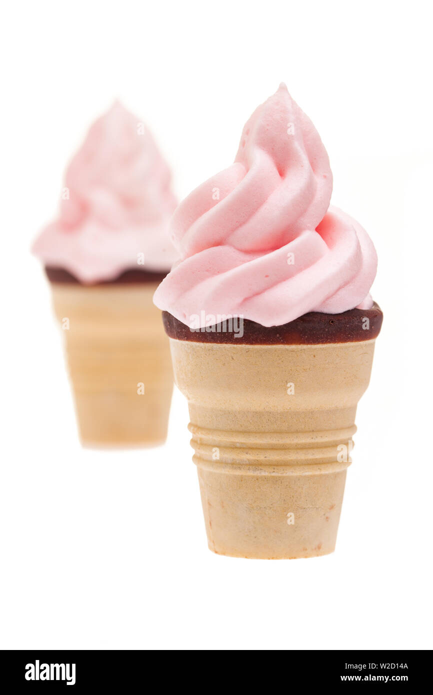 ice cream sundae: two pink ice cream cones with chocolate corner in front of white background Stock Photo