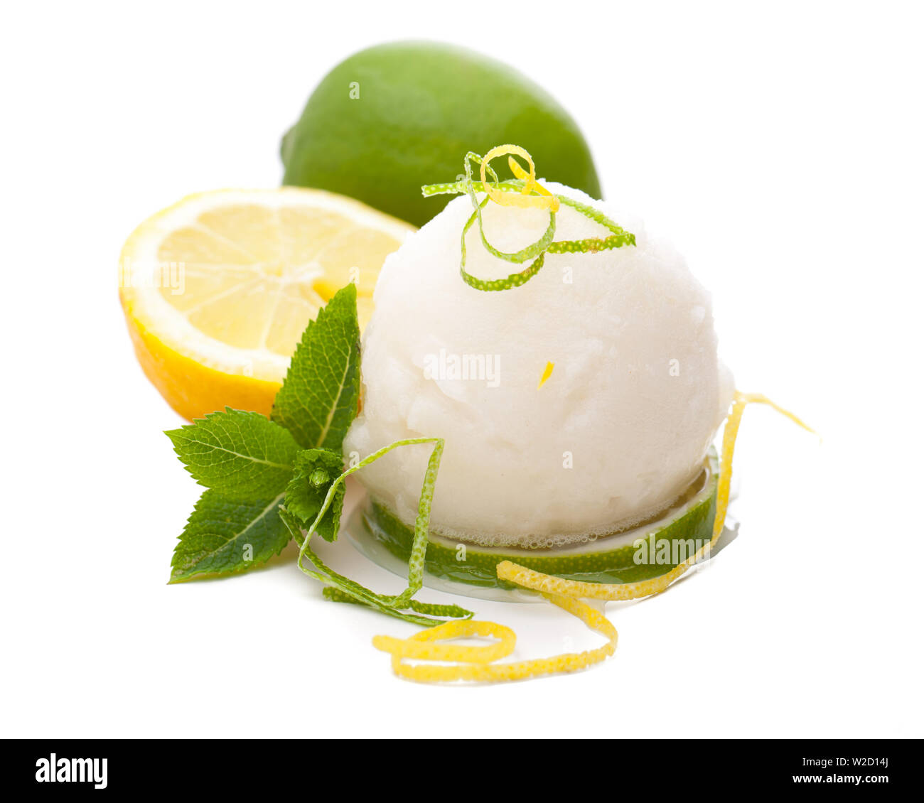 ice cream sundae: a single scoop of lemon ice cream with lemons and decoration in white background Stock Photo