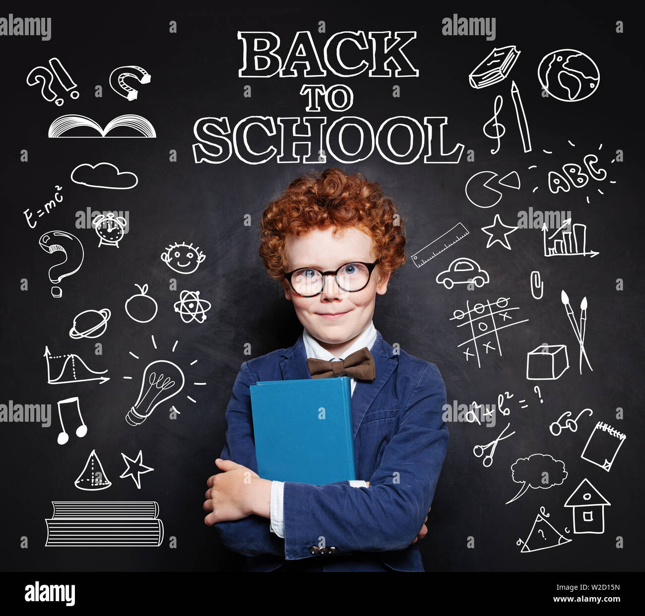 Curious kid school boy on chalkboard background. Back to school concept Stock Photo