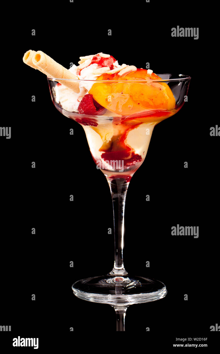 ice cream sundae: A cup of peach ice cream isolated on white background Stock Photo