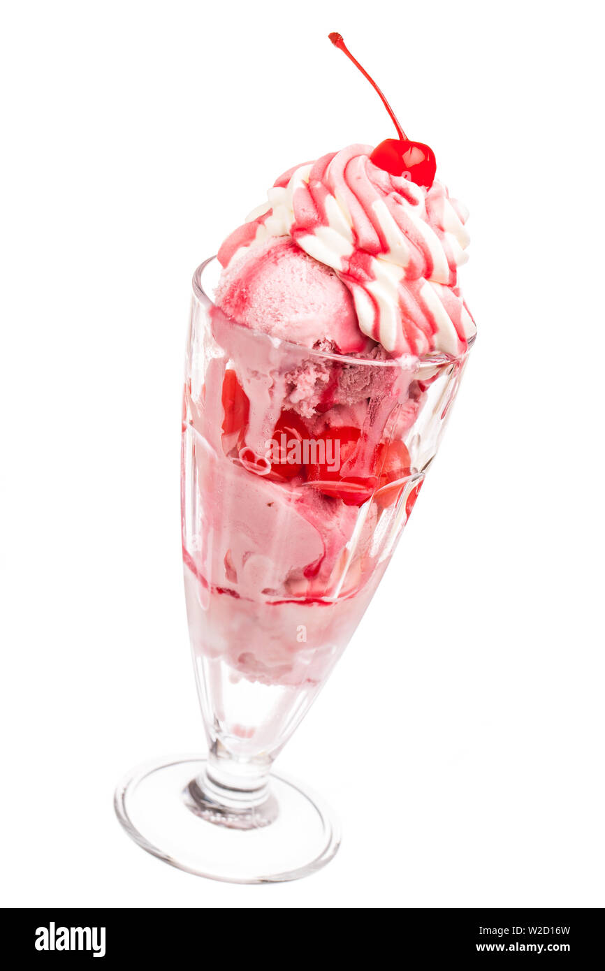 ice cream sundae: frozen cherry milkshake with cherry in top of whipped cream isolated on white background Stock Photo