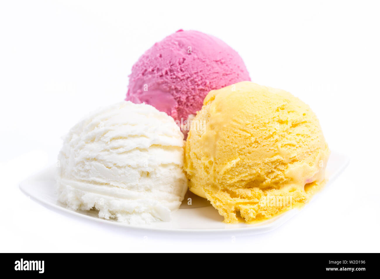 Bowl of three ice cream scoops - white, pink, and yellow