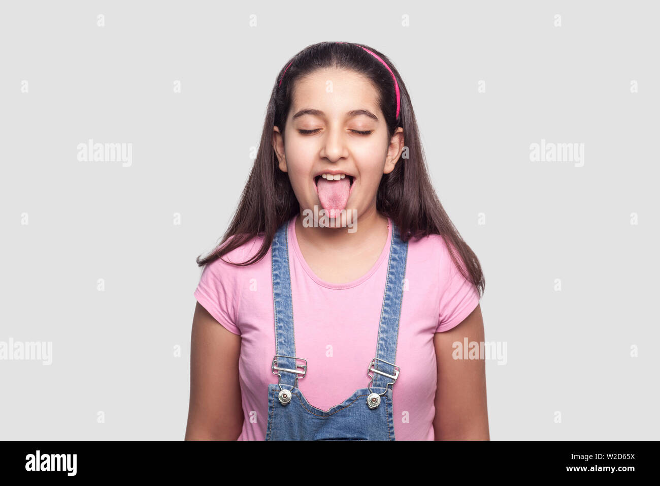 Portrait of funny beautiful young girl in casual style, pink t