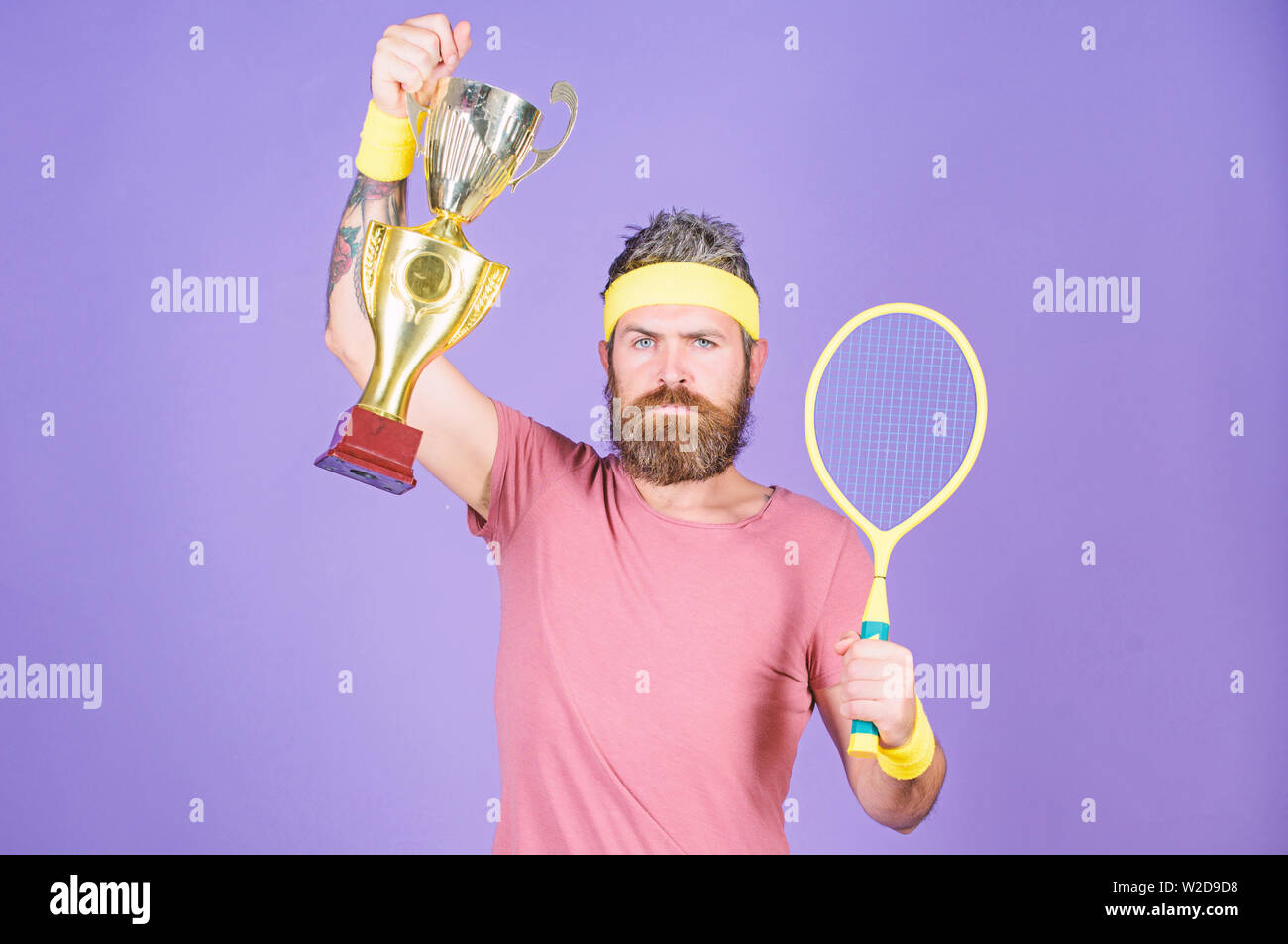 Tennis player win championship. Athlete hold tennis racket and golden  goblet. Man bearded hipster wear sport outfit. Success and achievement. Win tennis  game. Tennis match winner. Achieved top Stock Photo - Alamy