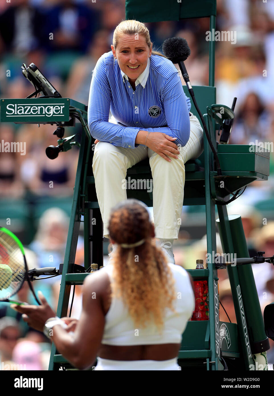 Chair umpire Aurelie Tourte speaks to Serena Williams after she