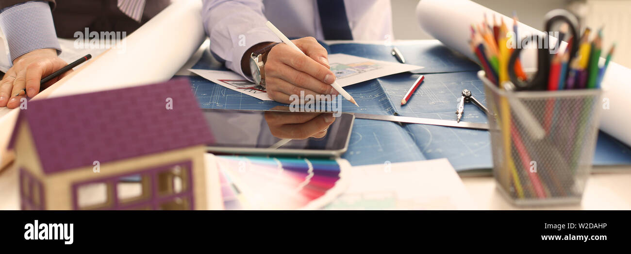 Two Engineer Architect Discussing House Project Stock Photo