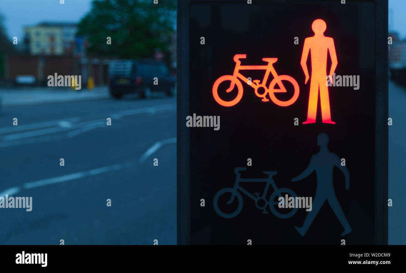 Pedestrian crossing traffic lights with red stop signal at dark evening ...