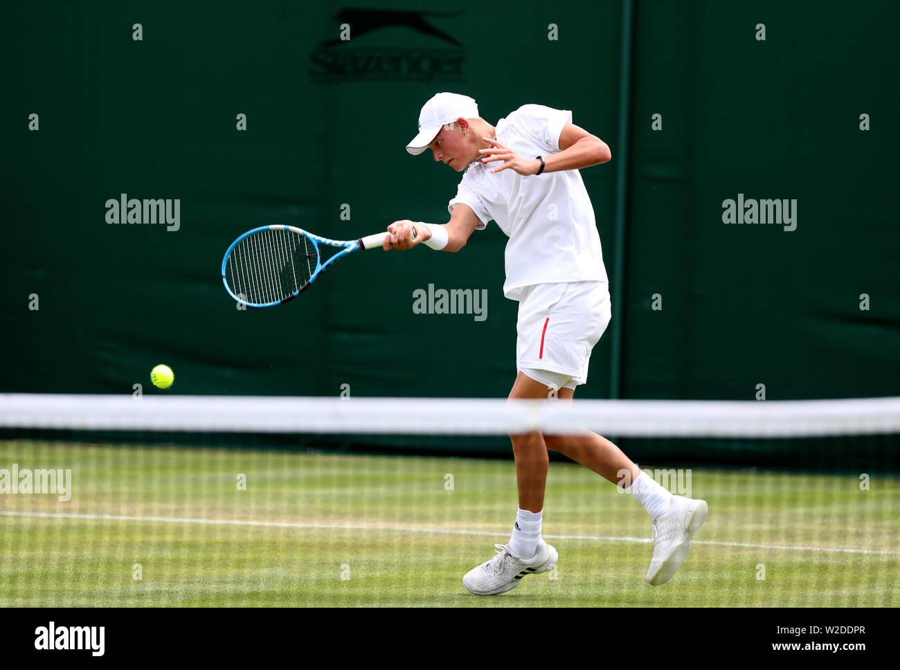 Blu Baker in action against Ryoma Matsushita in the boys singles on day seven of the Wimbledon Championships at the All England Lawn Tennis and Croquet Club, Wimbledon. Stock Photo