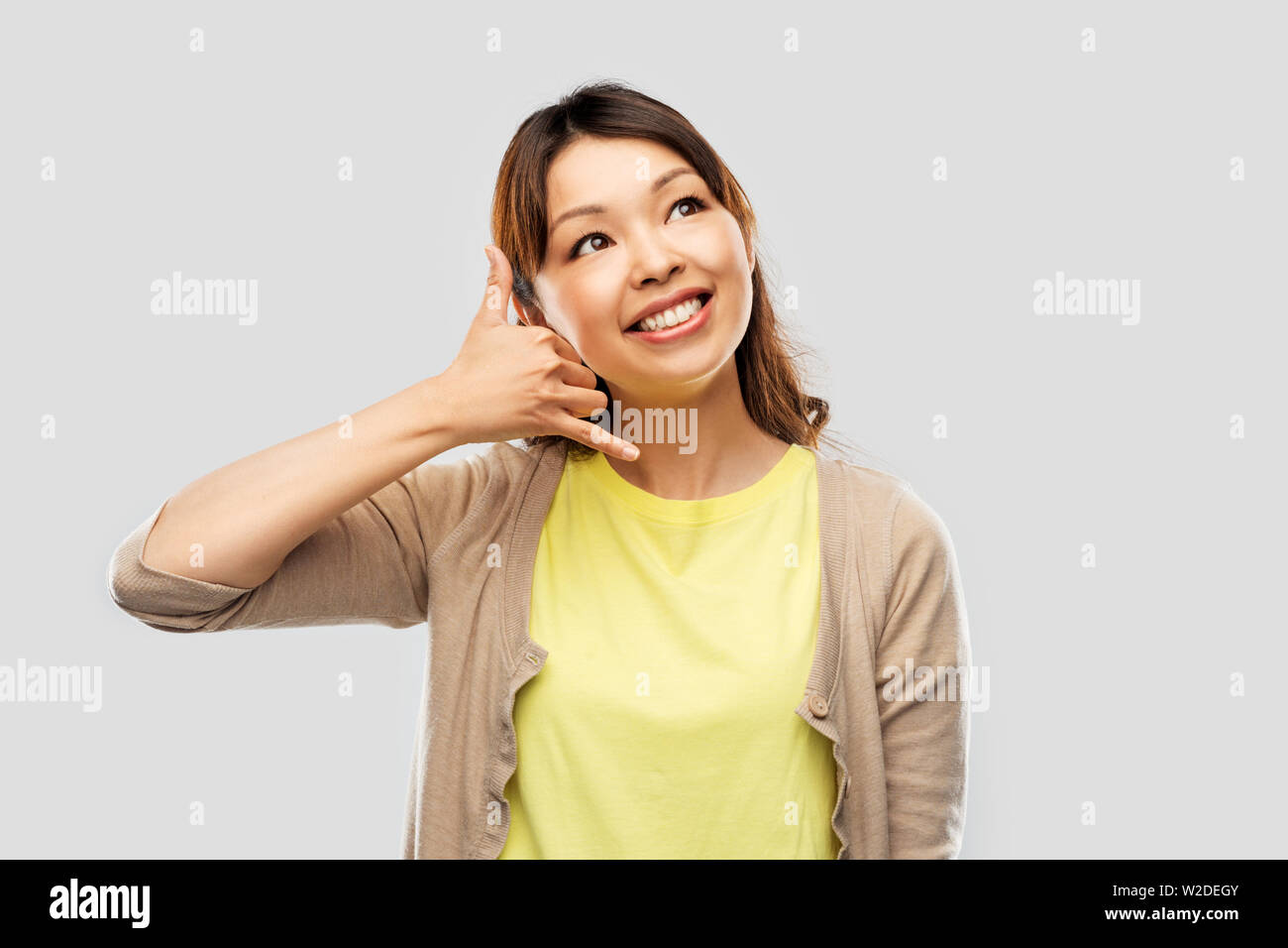 african asian making phone call gesture Stock Photo