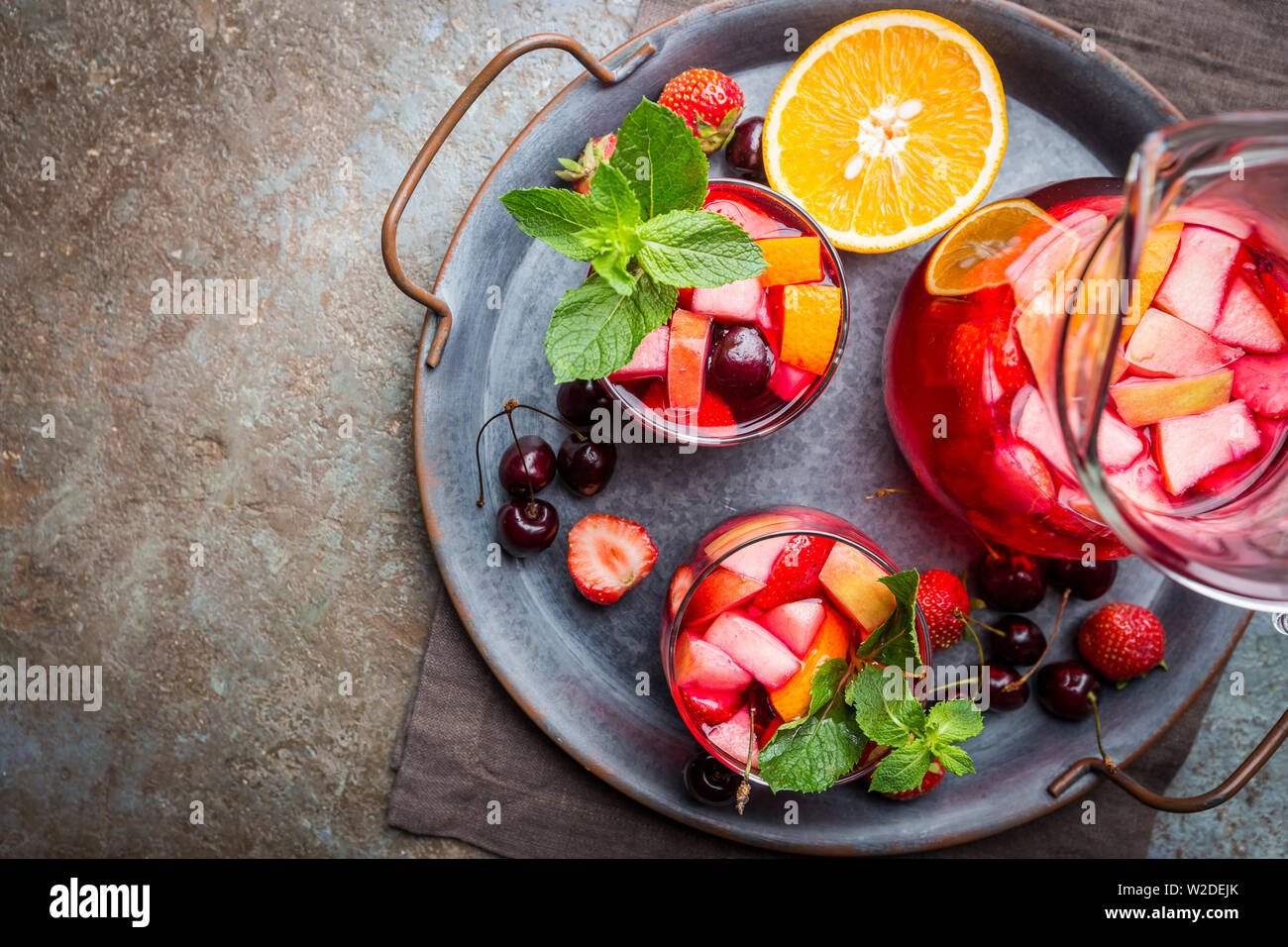 red-wine-sangria-or-punch-with-fruits-and-ice-in-glasses-top-view