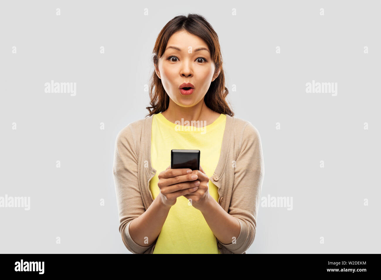 Shocked surprised young woman using hi-res stock photography and images ...