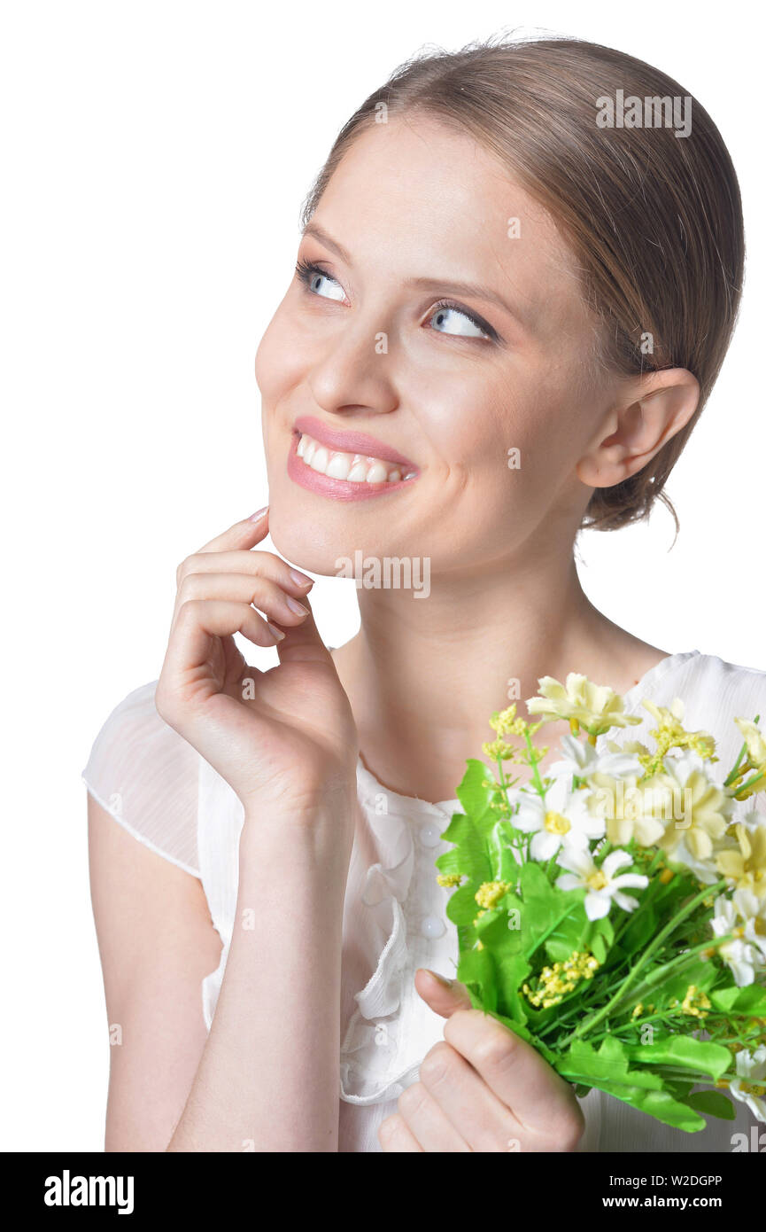 portrait of beautiful young woman with flowers on white background ...