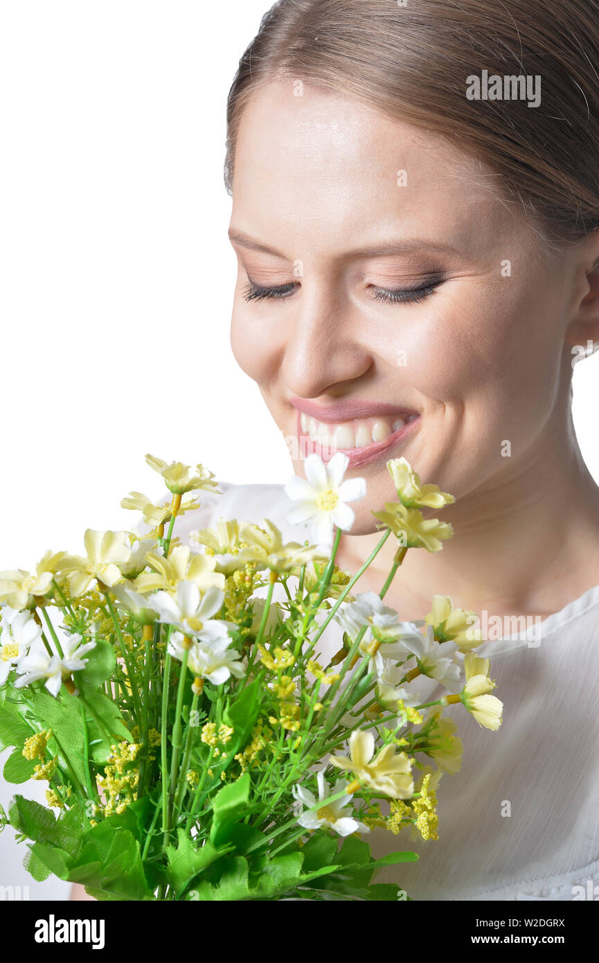 portrait of beautiful young woman with flowers on white background ...