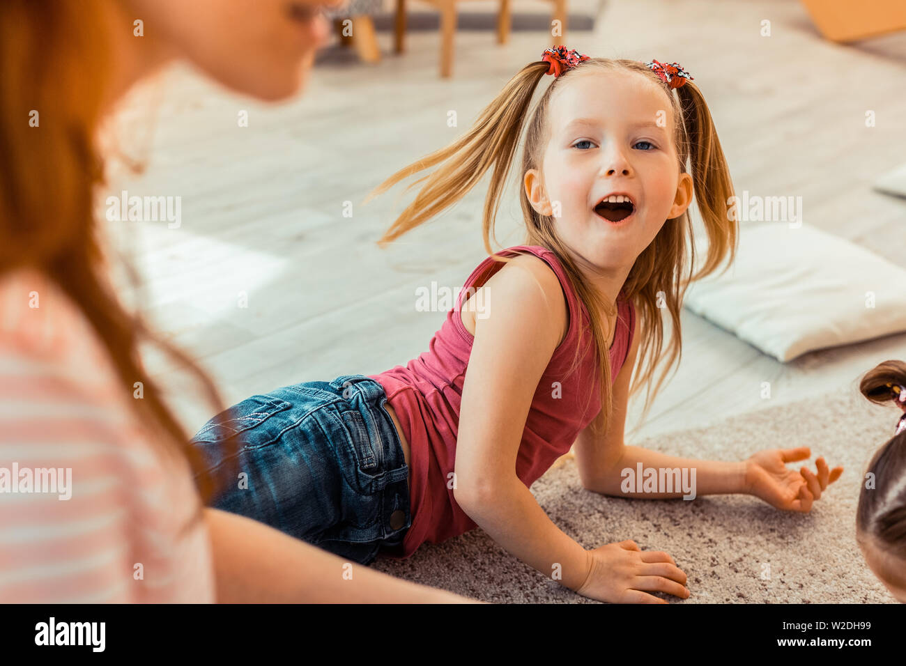 Happy excited girl being in a good mood Stock Photo