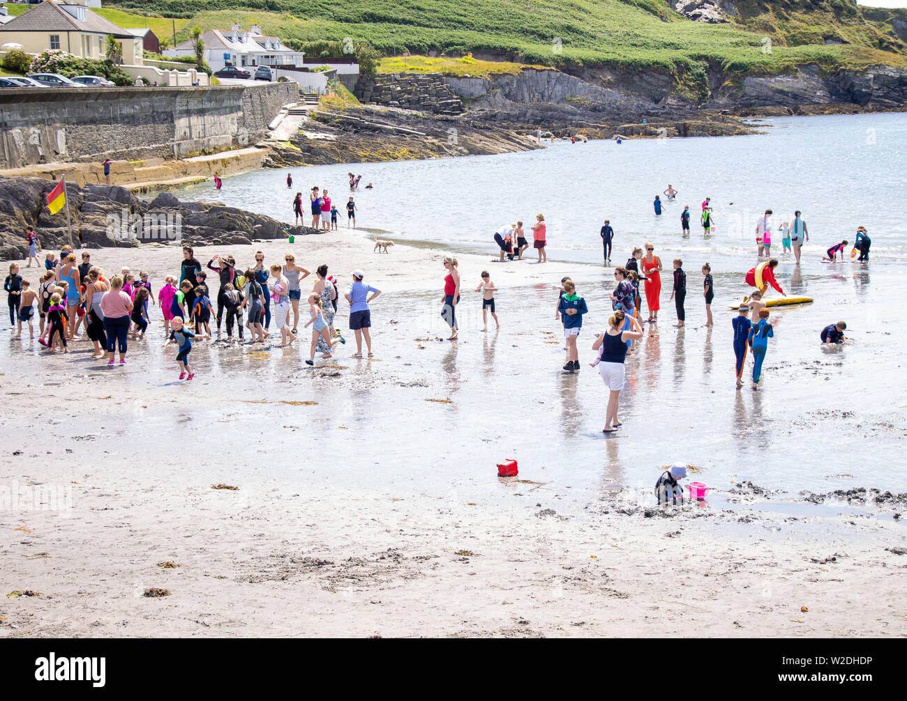 Tragumna, West Cork, Ireland, 8th July 2019, With temperatures in the mid twenty’s and children on holiday the families flocked to the beach at Tragumna. The beach has a blue flag for water quality and Life Guards keep the beach safe for swimmers.  Credit aphperspective/ Alamy Live News Stock Photo