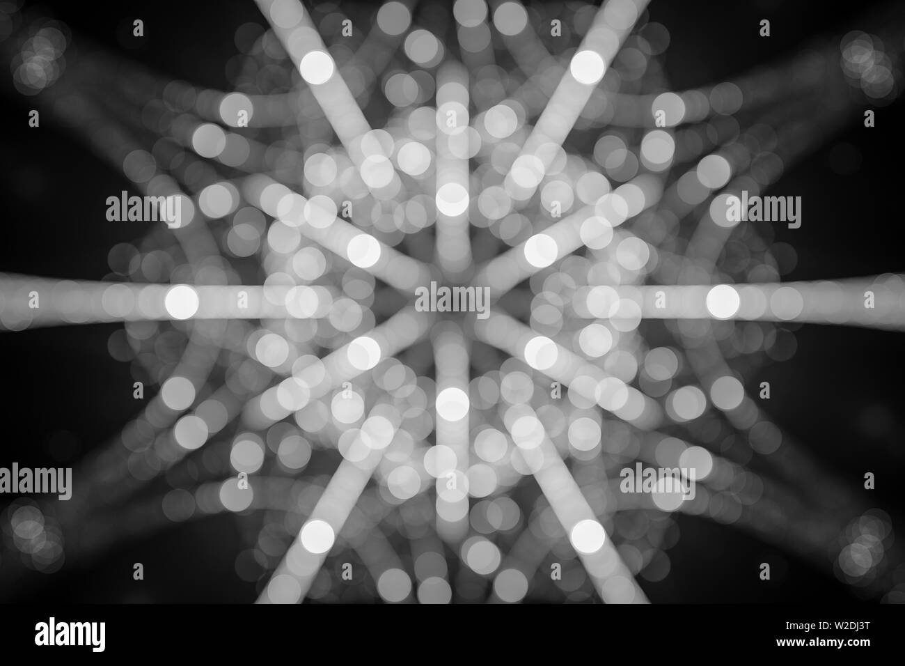 Glowing snowflake in bokeh, black and white texture, 3D rendering, computer generated Stock Photo