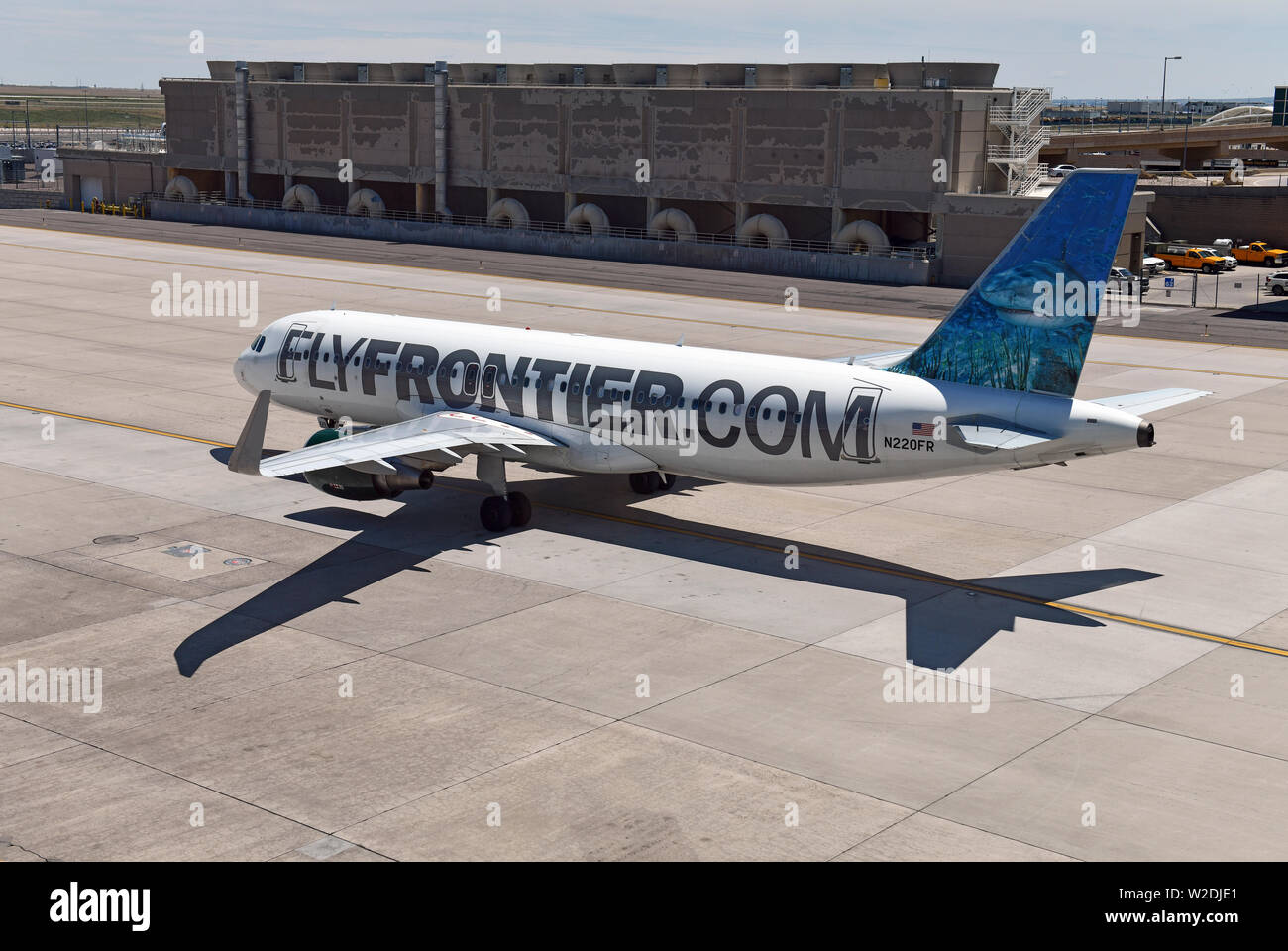 Frontier Airlines with aircraft at gate, while characterized as a low