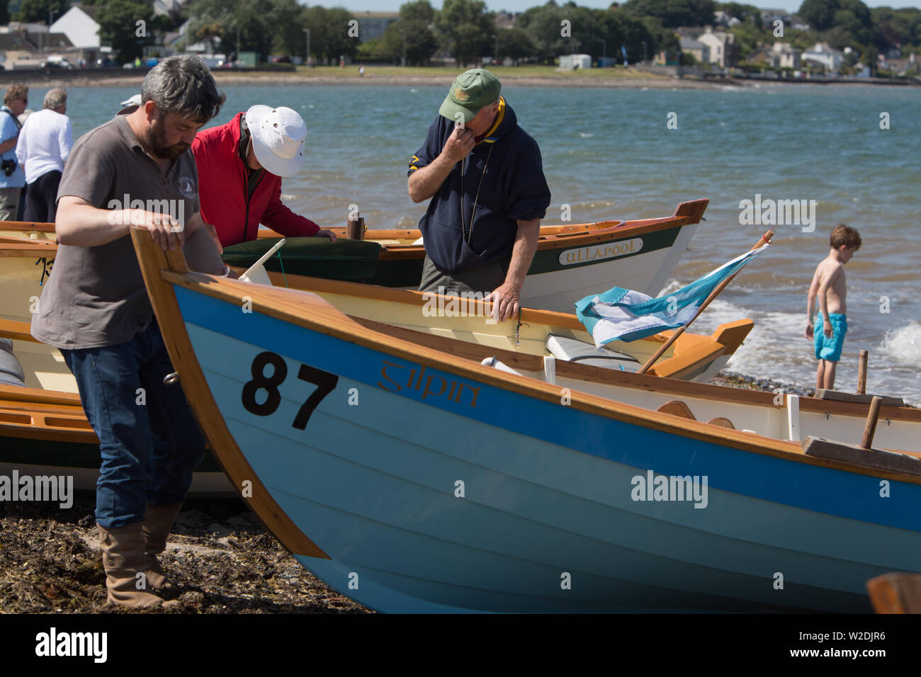 Stranraer, Scotland, UK. 7 July 2019. Competitors from around the country, and internationally, participate in the opening ceremonies of the Skiffieworlds 2019, which runs from 7th-13th July. Skiffieworlds is the World Championship for the St Ayles Skiff class of coastal rowing boat. The Championships are held every three years. Credit: Jeremy Sutton-Hibbert/ Alamy Live News Stock Photo