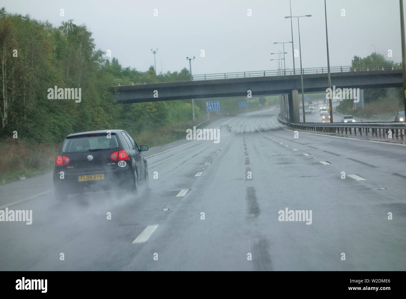 Treacherous road conditions on M5 with heavy rain, UK Stock Photo