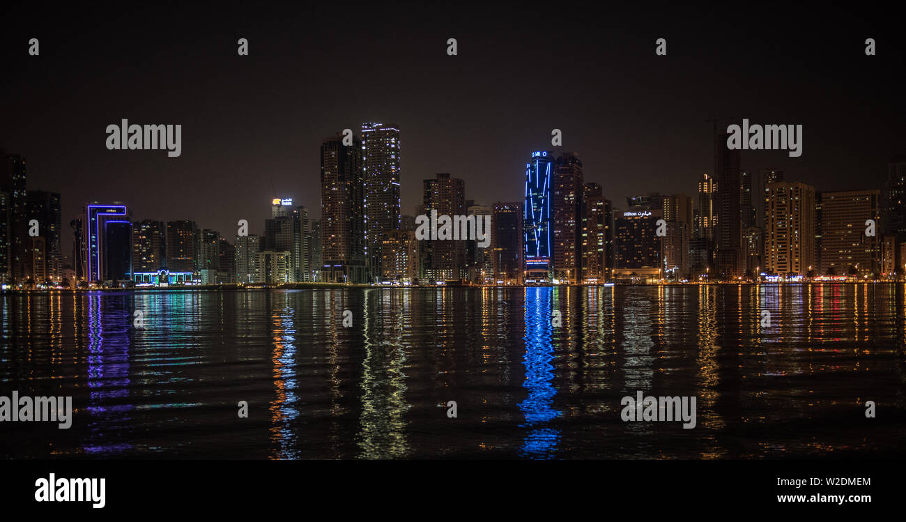 Sharjah Skyline from Al Noor Island at night Stock Photo