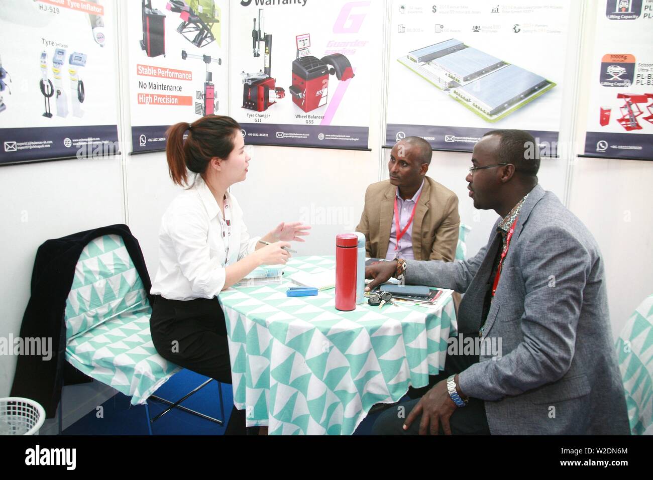 (190708) -- BEIJING, July 8, 2019 (Xinhua) -- A trader (L) converses with customers during the 5th Edition of China Trade Week at Kenyatta International Convention Center (KICC) in Nairobi, capital of Kenya, June 7, 2019. China Trade week is a series of successful Business-to-Business (B2B) and Business-to-Government (B2G) trade platforms across the Middle East and Africa covering multiple industries including building and construction materials, lighting, furniture and interior, technology, agriculture, textiles and auto parts. (Xinhua/Charles Onyango) Stock Photo