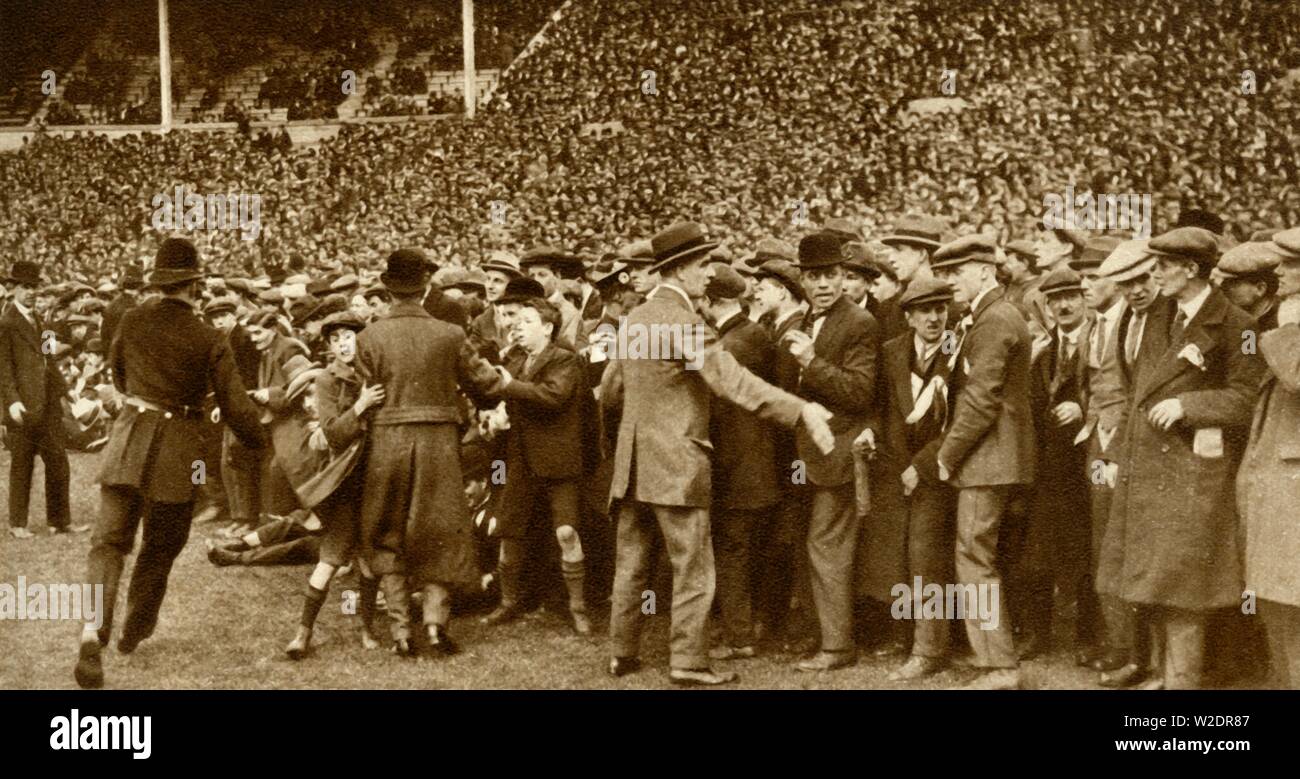 The first FA Cup Final is held at the new Wembley Stadium in London, 28