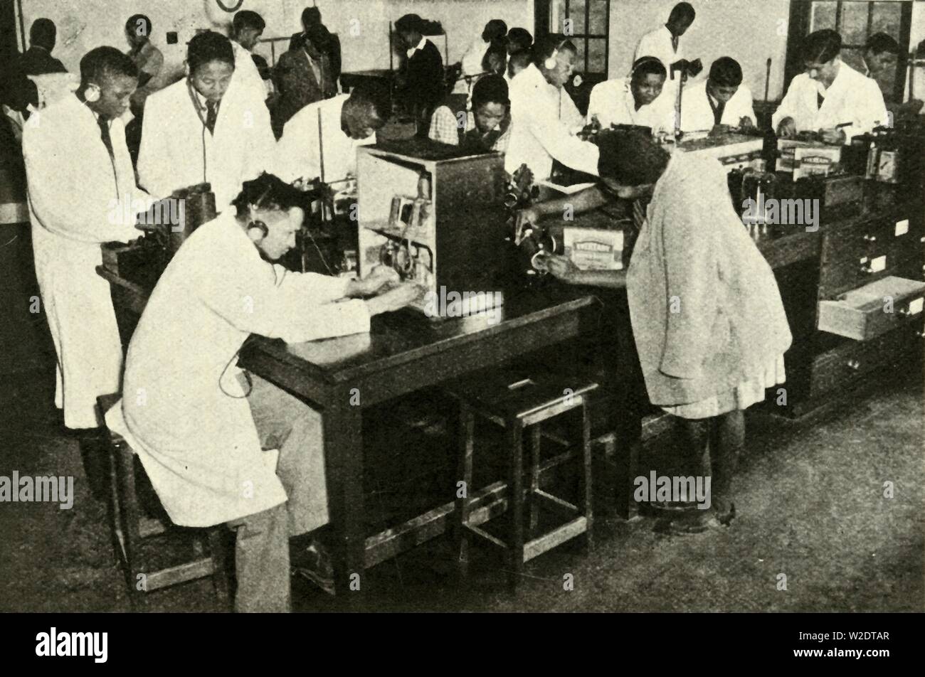 'Scenes in a Native College - Students in the physics laboratory', c1948. Creator: Unknown. Stock Photo